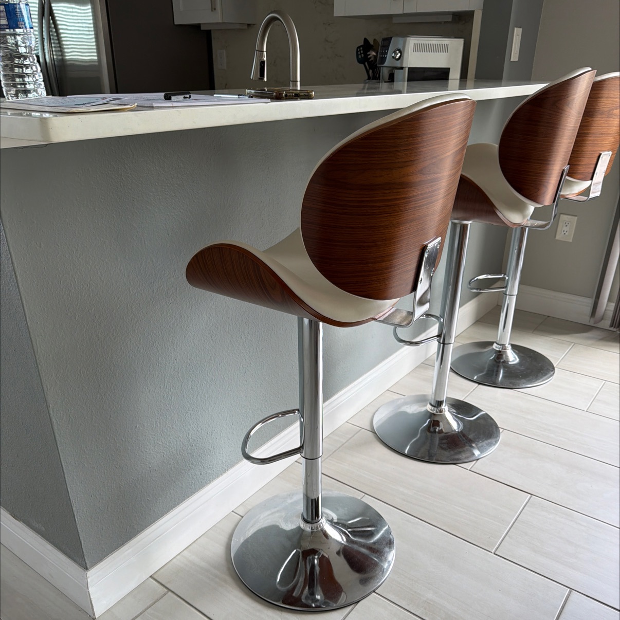 Set of 3 Adjustable Swivel Bar Stools with Tan Faux Leather Seats and Chrome Tulip Base